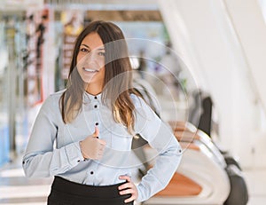 Woman giving thumbs up.