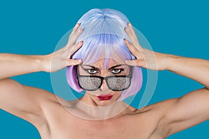 Woman in glamour glasses holding head