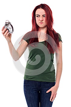 Woman glaring at her alarm clock photo