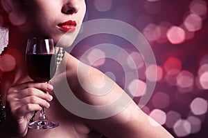 Woman with glass red wine