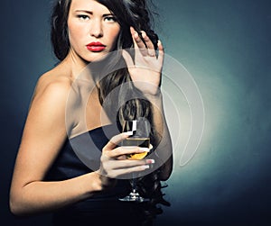 Woman with a glass of white wine