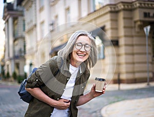 Woman With Glasses Holding a Cup of Coffee