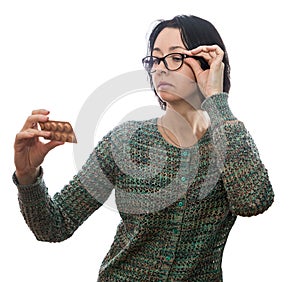 Woman in glasses looks at medicament