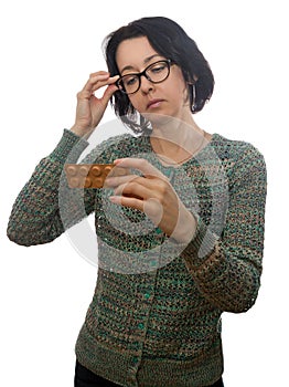 Woman in glasses looks at medicament