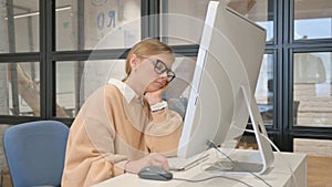 Woman in Glasses Sleeping in Office