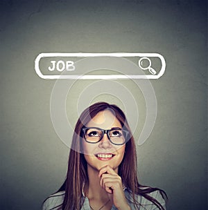 Woman in glasses thinking looking for a new job