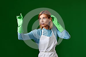 woman in gloves and cleaner apron touching virtual screen