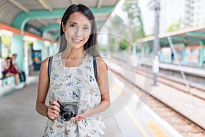 Woman go travel with her camera