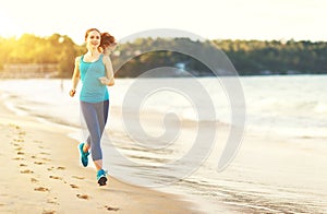 Woman goes in for sports jogging on beach