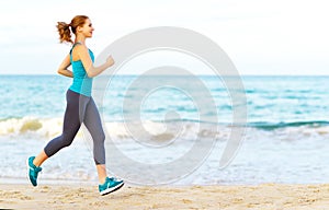 Woman goes in for sports jogging on beach