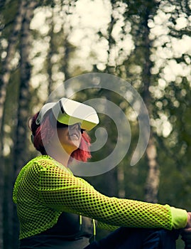 Woman goes into virtual reality using virtual reality headset.