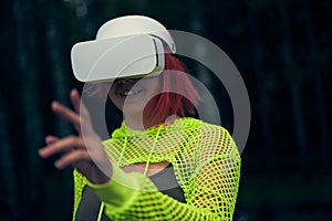 Woman goes into virtual reality using virtual reality headset.