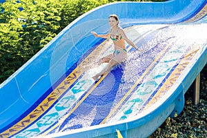 Woman going down a water slide