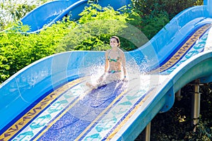 Woman going down a water slide