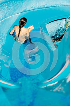 Woman going down a water slide