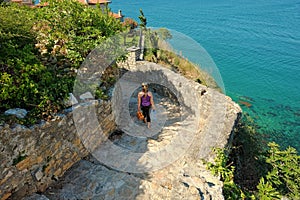Woman Going Downstairs In Ulcinj Stari Grad, Montenegro