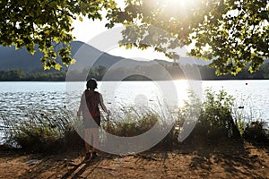 Woman going on excursion and contemplating the sunset