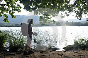 Woman going on excursion and contemplating the sunset