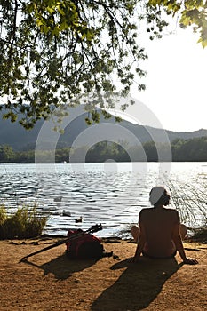 Woman going on excursion and contemplating the sunset