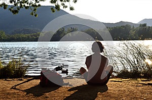 Woman going on excursion and contemplating the sunset