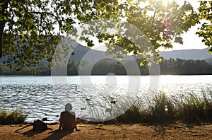 Woman going on excursion and contemplating the sunset