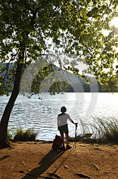 Woman going on excursion and contemplating the sunset