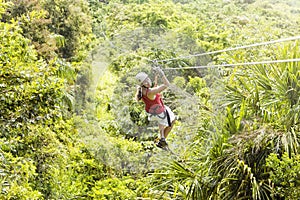 Woman going on a jungle zipline adventure