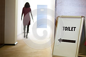 Woman going to toilet