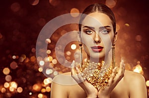 Woman Gold Beauty, Fashion Model Holding Golden Jewelry