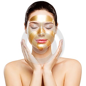 Woman Gold Mask, Beautiful Model with Golden Skin Cosmetic, Beauty Skincare and Treatment photo