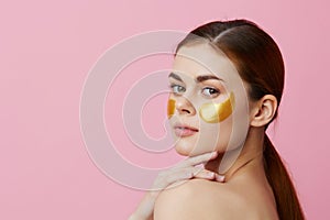 woman golden patches on the face isolated background