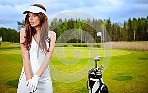 woman with golf equpment