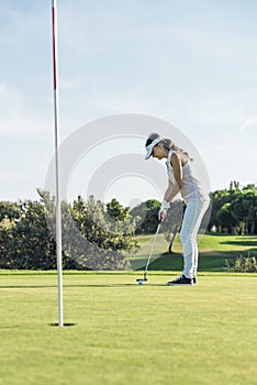 Woman golf player concentrating.