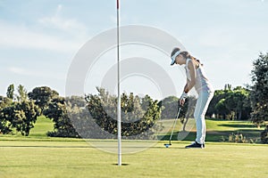 Woman golf player concentrating.