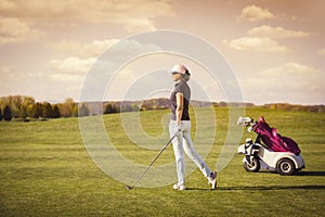 Woman golf player with copyspace.