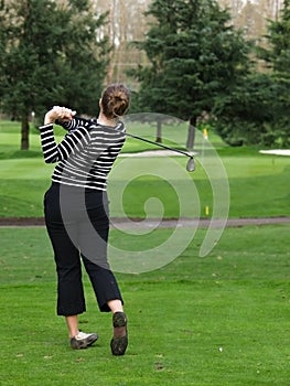 Woman golfer swing