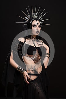 Woman in gothic suit and silver crown