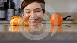 Woman grabbing a croissant