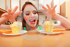 Woman grabbing delicious sweet cake. Gluttony.