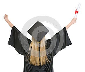 Woman in graduation gown rejoicing success