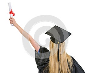 Woman in graduation gown rejoicing success