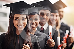 Woman, graduation and portrait of a college group with a diploma and smile outdoor. Diversity men and women students