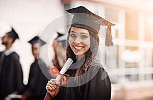 Woman, graduation and portrait of a college student with a diploma and smile outdoor. Female person excited to celebrate