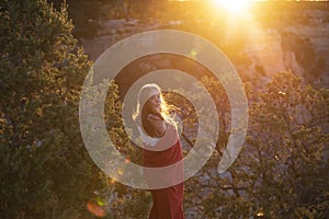 Woman in Grand Canyon. Carefree freedom concept. Life winner at cliff.