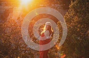 Woman in Grand Canyon. Carefree freedom concept. Life winner at cliff.