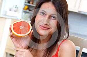 Woman with grapefruit