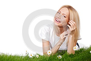 Woman on grass with flowers