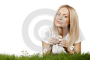 Woman on grass with flowers