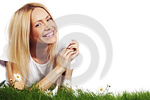 Woman on grass with flowers