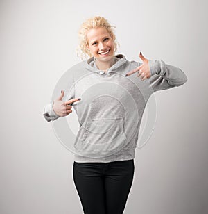 Woman in gray hoodie, mockup for logo or branding design